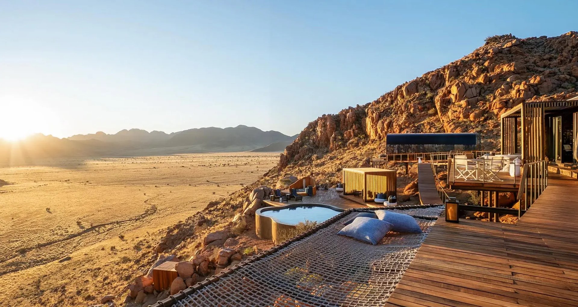 Luna’s plunge pool and decks on a rocky ridge above the desert plains