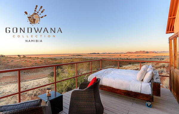 Lodge bed on balcony with Namib desert view, Namibia