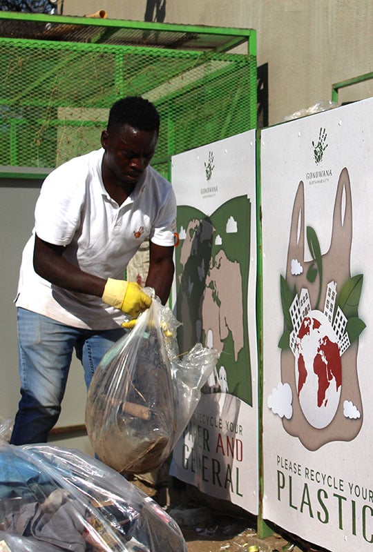 Lodge team member sorting waste for recycling, Namibia